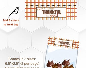 May include: Printable Thanksgiving treat bag tags with a plaid pattern and the text "So Very Thankful For You!" in brown text with a banner above. The tags are designed to be folded and attached to a treat bag. The image also shows a bag of chocolate kisses with the same tag design.