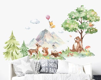 May include: A watercolor-style wall decal featuring a woodland scene with a mountain, a tree, a deer, a squirrel, a rabbit, a fox, and a bear. The decal is perfect for a nursery or child's room.