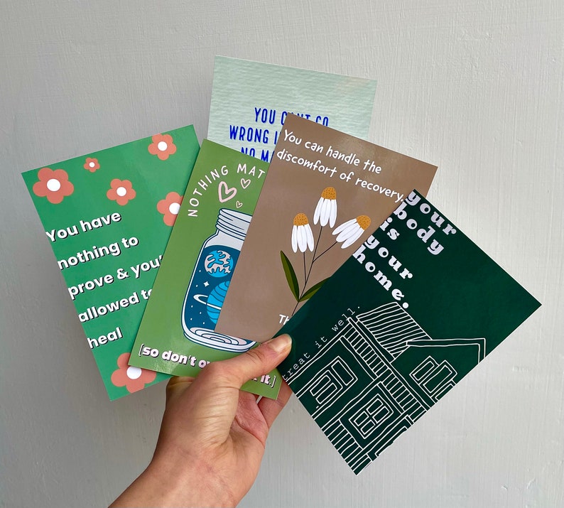 May include: Four green, white, and brown cards with inspirational quotes about self-care and healing. The quotes include "You have nothing to prove & you're allowed to heal", "Nothing matters more than your body is your home", "You can handle the discomfort of recovery", and "Treat it well".