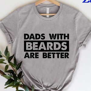 May include: A white ceramic mug with a black handle and the text "But First, Coffee" in a bold, black font. The mug is set against a neutral background, highlighting its simple design.