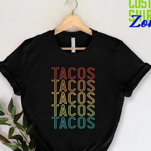 a black shirt with the words tacos on it