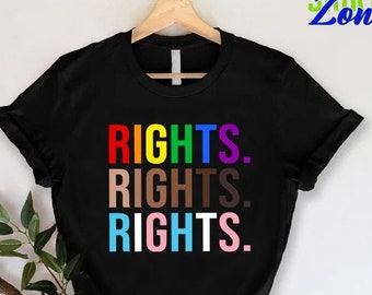 May include: Black t-shirt with the words "RIGHTS." repeated three times in rainbow colors.