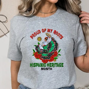 a woman wearing a t - shirt that says proud of my roots hispanic heritage month
