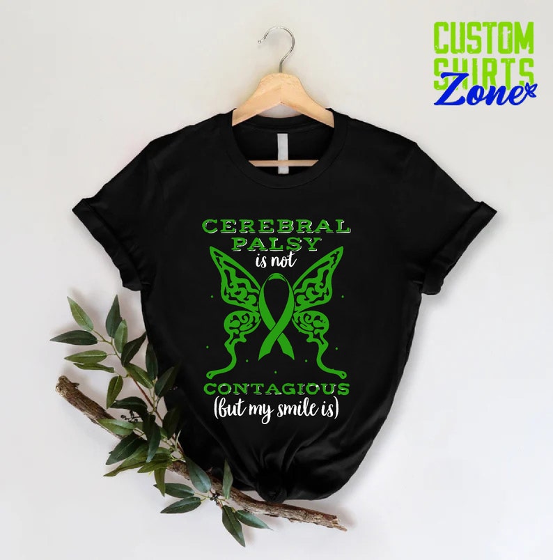 May include: Black t-shirt with a green butterfly design and the text "Cerebral Palsy is not contagious (but my smile is)".