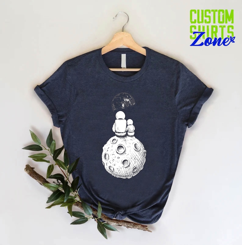 a t - shirt with an image of a man on the moon