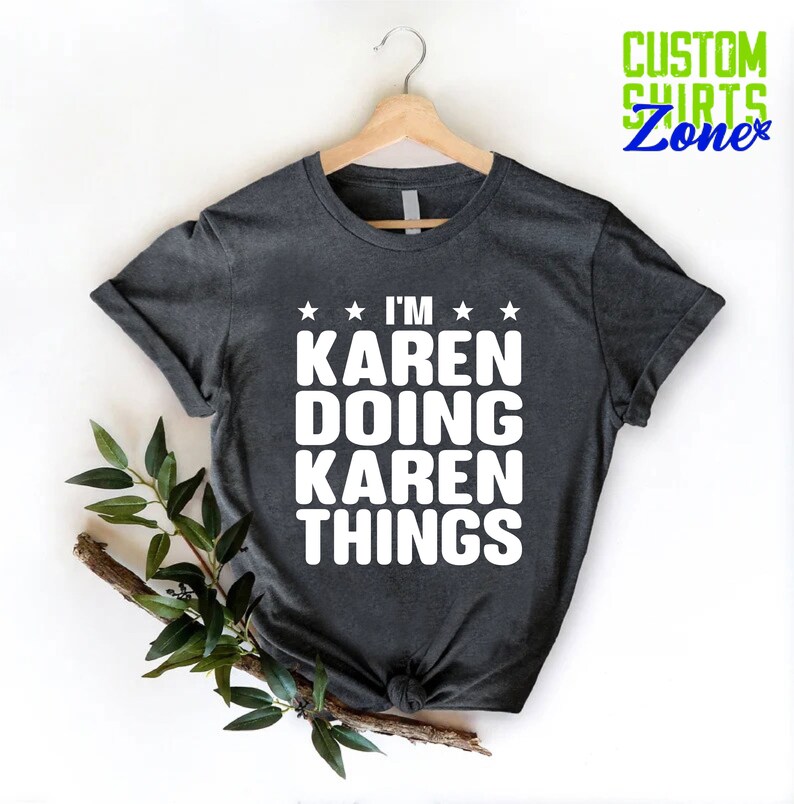 May include: A dark gray t-shirt with white text that reads "I'm Karen Doing Karen Things".