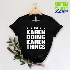May include: Black t-shirt with white text that reads "I'm Karen Doing Karen Things" with three stars above and below the text.