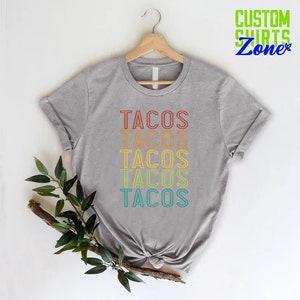a t - shirt with the words tacos on it