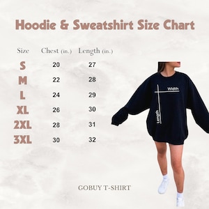 Pode incluir: Uma tabela de tamanhos para hoodies e sweatshirts com medidas em polegadas. A tabela mostra as medidas de peito e comprimento para os tamanhos S, M, L, XL, 2XL e 3XL. Uma sweatshirt preta &eacute; mostrada em um modelo.