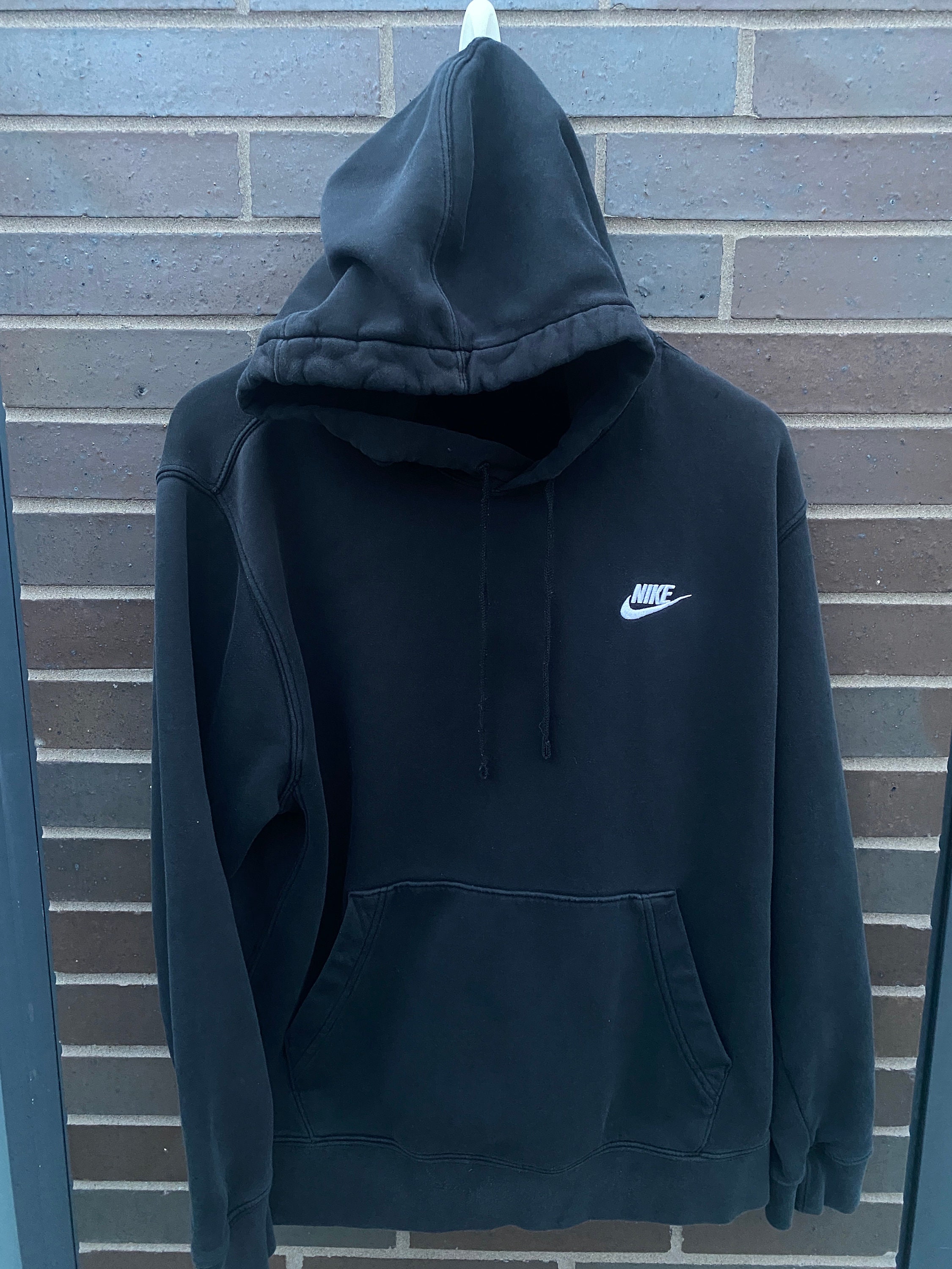Nike hoodie with shop logo in the middle