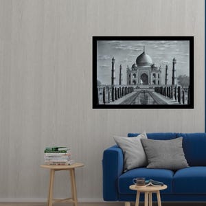 May include: A black and white pencil drawing of the Taj Mahal, a famous mausoleum in India. The drawing is framed and hanging on a wall in a living room setting.