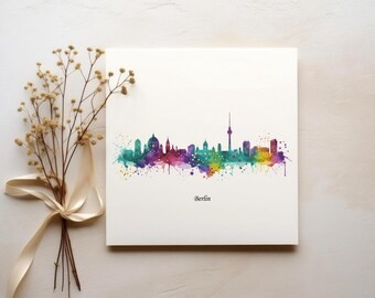 May include: A watercolor painting of the Berlin skyline in shades of purple, blue, green, and yellow. The painting is on a white background with the word "Berlin" printed below the skyline.