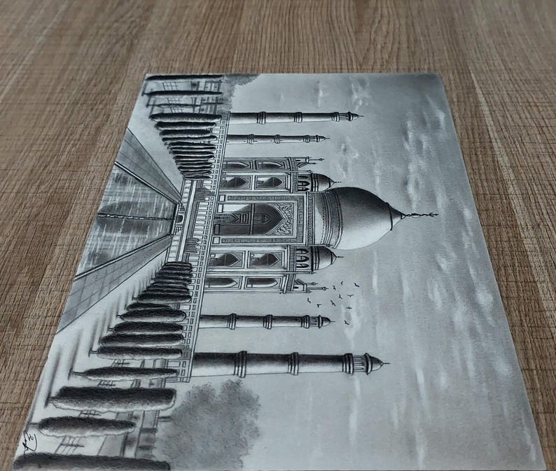 May include: A black and white pencil drawing of the Taj Mahal, a famous mausoleum in India. The drawing depicts the intricate details of the building, including the minarets, domes, and arches. The drawing is done in a realistic style and captures the beauty of the Taj Mahal.