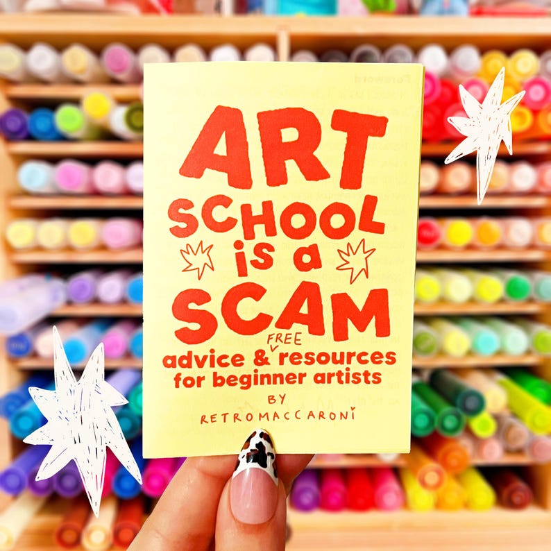 May include: A rectangular yellow card with red text that reads ART SCHOOL is a SCAM, FREE advice & resources for beginner artists, BY RETROMACCARONI. The card features hand-drawn star illustrations in white and black ink on the front surface.
