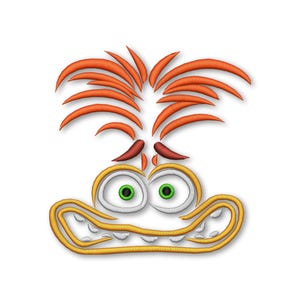 Puede incluir: Cara de dibujos animados bordada con pelo naranja, ojos verdes y una amplia sonrisa con dientes. La cara está bordada con hilo amarillo, naranja y blanco.