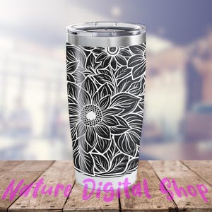 May include: A black and white stainless steel tumbler with a floral design. The design features large, detailed flowers with intricate patterns.