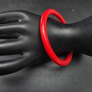 May include: A white ceramic mug with a black handle and the text "But First, Coffee" in a black, bold font. The mug is on a white surface. The mug is 4 inches tall.