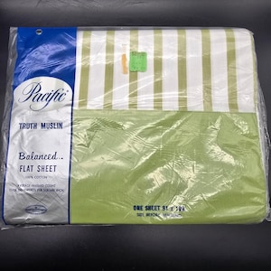 May include: A Pacific brand flat sheet in 100% cotton, packaged in clear plastic. The sheet features a white and light green striped pattern on the top section and a solid light green bottom section. Text includes Truth Muslin, Balanced, and 81 x 108.