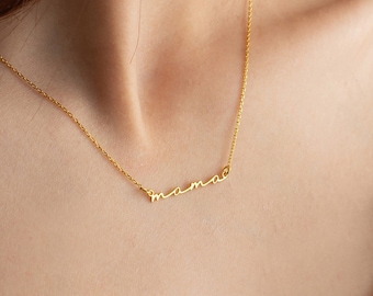 May include: A gold necklace with a delicate chain and a cursive 'mama' pendant.