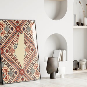 May include: A framed print of a geometric pattern in red, blue, and white. The pattern is reminiscent of traditional embroidery or textile designs.