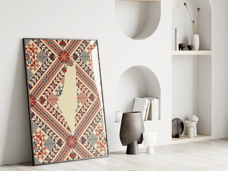 May include: A framed print of a geometric pattern in red, blue, and white. The pattern is reminiscent of traditional embroidery or textile designs.