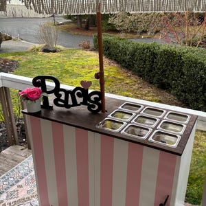 Folding charcuterie cart with customizable top. Pink striped. 48x23x36”h
