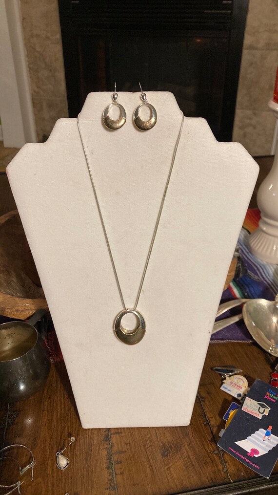 good and silver tone necklace and earring. by Liz 