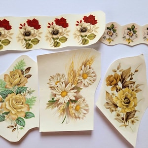 May include: Five vintage floral paper decoupage sheets with various designs. The sheets feature white, yellow, and red flowers with green leaves. Some sheets have a textured background.