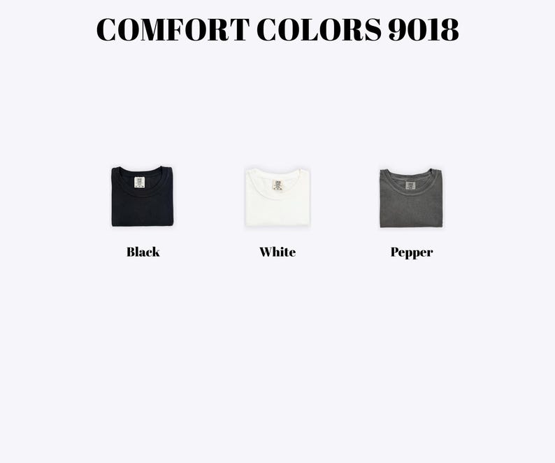 three different colored t-shirts, each with a label indicating the color: black, white, and pepper.
