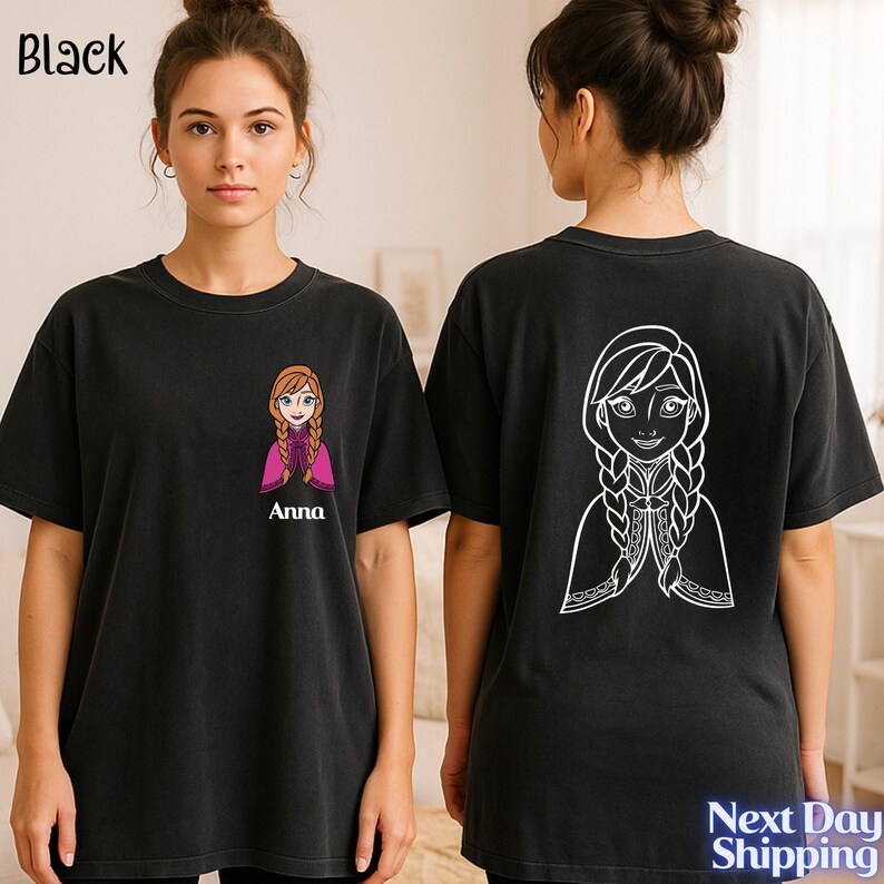 A woman wearing a black t-shirt with a cartoon character printed on the back.