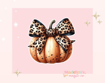 May include: A brown pumpkin with a leopard print bow. The pumpkin is decorated with small brown spots.
