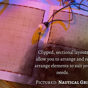 May include: A close-up of a book with two pages open, showing a grid pattern on each page. The text on the page reads "Clipped, sectional layouts allow you to arrange and rearrange elements to suit your needs. PICTURED: NAUTICAL GRIDS".
