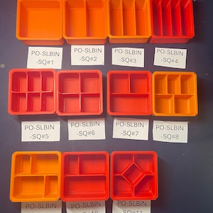 May include: Eleven orange and red plastic storage containers with different compartment configurations. The containers are labeled PO-SLBIN -SQ#1 through PO-SLBIN -SQ#11.