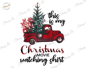 May include: A red vintage truck illustration carrying a Christmas tree and wrapped gifts. Text on the image reads "this is my Christmas movie watching shirt."