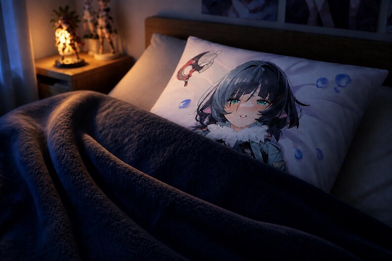 May include: A rectangular white pillowcase featuring a printed anime-style illustration of a character with dark hair, teal eyes, and cat-like ears, accented by floating blue droplets and a small red and white circular emblem on the upper left corner.
