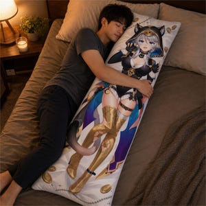 May include: A rectangular body pillow featuring a printed anime-style character with silver hair, cat ears, and a dark outfit with gold accents. The character is depicted in a dynamic pose against a white background with scattered gold coin illustrations.
