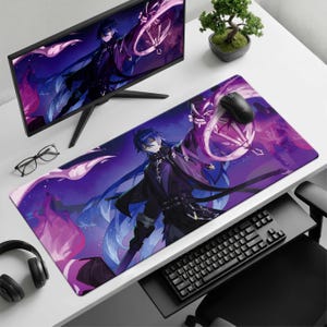 May include: A rectangular desk mat featuring a vibrant purple and blue anime-style illustration of a character with long dark hair holding a glowing lantern. The mat is positioned on a white desk alongside a computer monitor, keyboard, and mouse.