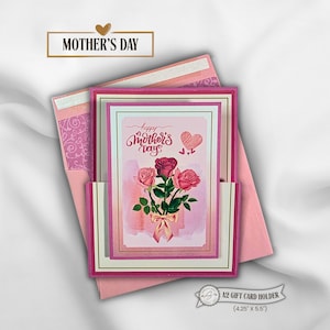 May include: A pink Mother's Day gift card holder with a floral design. The card features a bouquet of roses and the text "Happy Mother's Day." The holder is an A2 size, measuring 4.25" x 5.5".