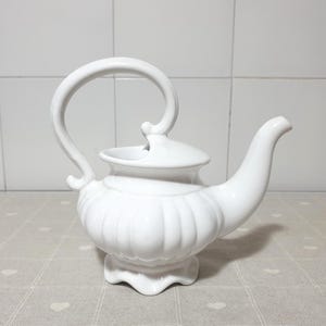 Vintage classic country teapot in fine white ceramic