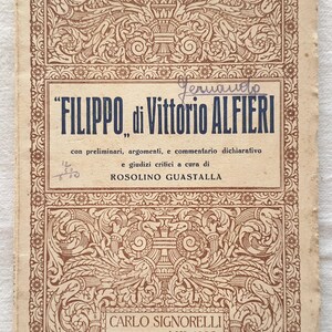 May include: A vintage book cover with an ornate border and the title "FILIPPO di Vittorio ALFIERI" in blue text. The book is part of a series called "SCRITTORI ITALIANI E STRANIERI" and is published by Carlo Signorelli, Editore, Milano.