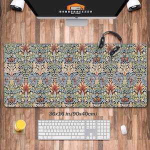 May include: A colorful floral patterned mousepad with a dark blue background. The mousepad measures 36x16 inches (90x40 cm). The text "KONDERAFISCO Est. 2020" is printed in the top center of the mousepad.
