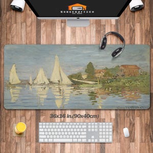 May include: A rectangular desk mat featuring a serene landscape painting of sailboats on a river. The artwork depicts a cloudy sky and a small village. The mat measures 36 x 16 inches.