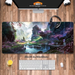 May include: A large, colorful mousepad with a fantasy landscape featuring mountains, waterfalls, and trees with pink flowers. The mousepad measures 36x16 inches (90x40 cm).