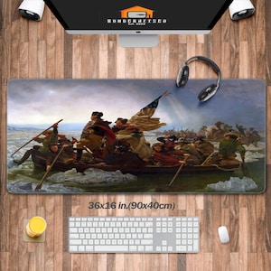 May include: A large, rectangular mousepad featuring a painting of a group of men in a boat, crossing a frozen river. The men are dressed in period clothing and are holding oars. The American flag is visible in the background. The mousepad is 36x16 inches (90x40 cm).