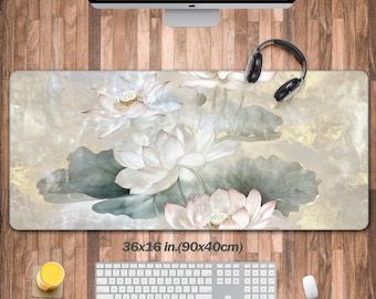 May include: A large, rectangular mouse mat with a floral design featuring white lotus flowers on a light grey background with gold accents. The mouse mat measures 36x16 inches (90x40 cm).
