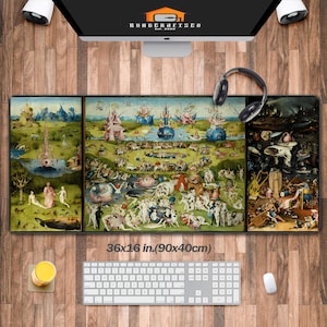 May include: A large mouse pad featuring a triptych artwork with a detailed, fantastical landscape. The pad measures 36 x 16 inches. A keyboard, mouse, and headphones are visible.