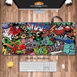 May include: A colorful, abstract, graphic design mousepad with a variety of colors, including red, green, blue, yellow, and black. The mousepad is 36x16 inches (90x40 cm).