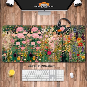May include: A floral mouse pad featuring a vibrant garden scene with pink roses and various colorful flowers. The mouse pad measures 36 x 16 inches. The text "KONDERAFISCO Est. 2020" is visible on the computer screen.