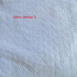 Puede incluir: Tela blanca con un dise&ntilde;o floral calado. El texto "fabric design 2" est&aacute; impreso en rojo. El texto "yogneecreation" est&aacute; impreso en rojo en la parte inferior de la tela.