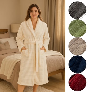 May include: A cream-coloured, ribbed-texture robe with a shawl collar, pockets, and a matching belt. The robe is knee-length and is displayed on a person. The image also shows close-ups of fabric samples in various colours.